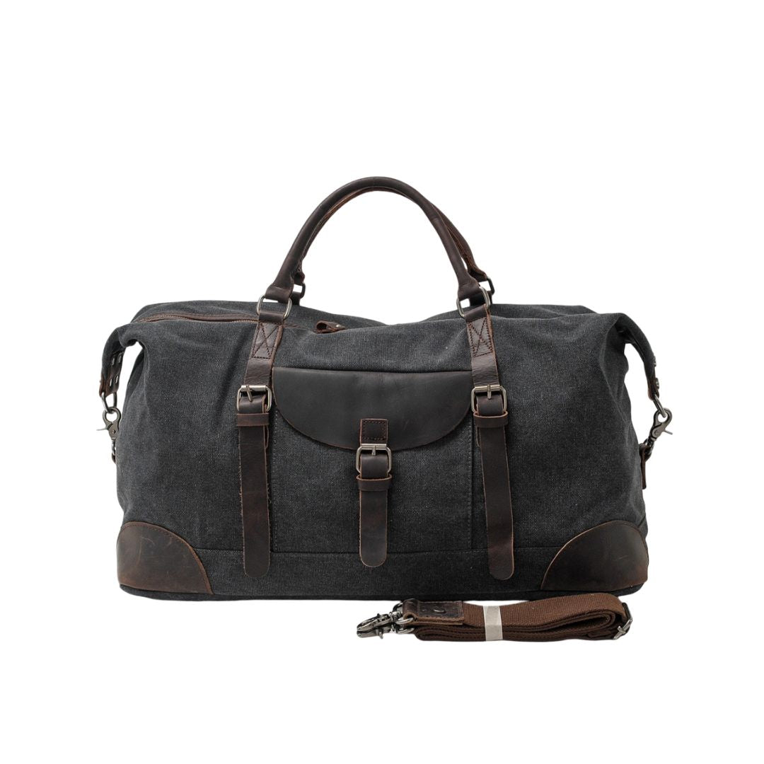 Rugged men's travel duffle bag, a stylish carry-on for weekend trips. Durable canvas and comfy shoulder strap.