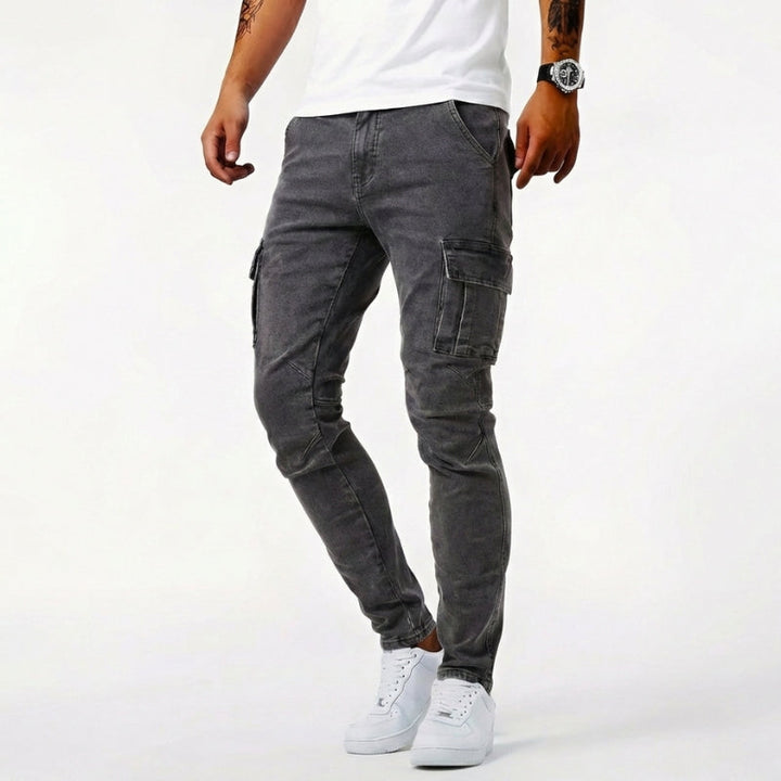 Men's durable blue denim cargo pocket jeans, ideal for workwear & casual comfort. Features rugged construction & handy pockets.