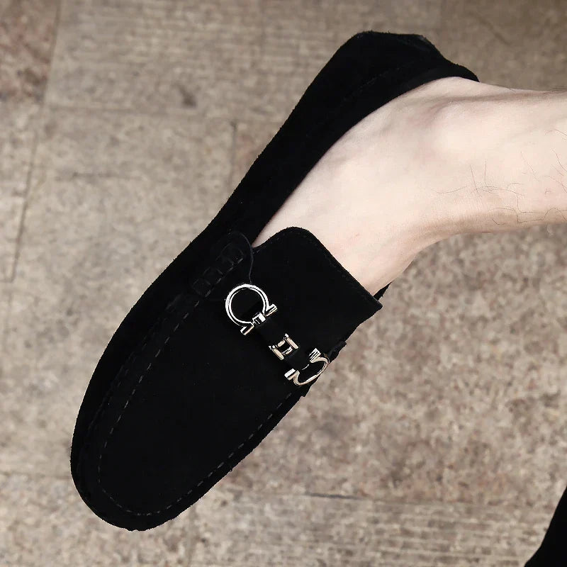 Comfortable grey slip-on loafers for men. Versatile driving shoes for casual or smart-casual fashion.