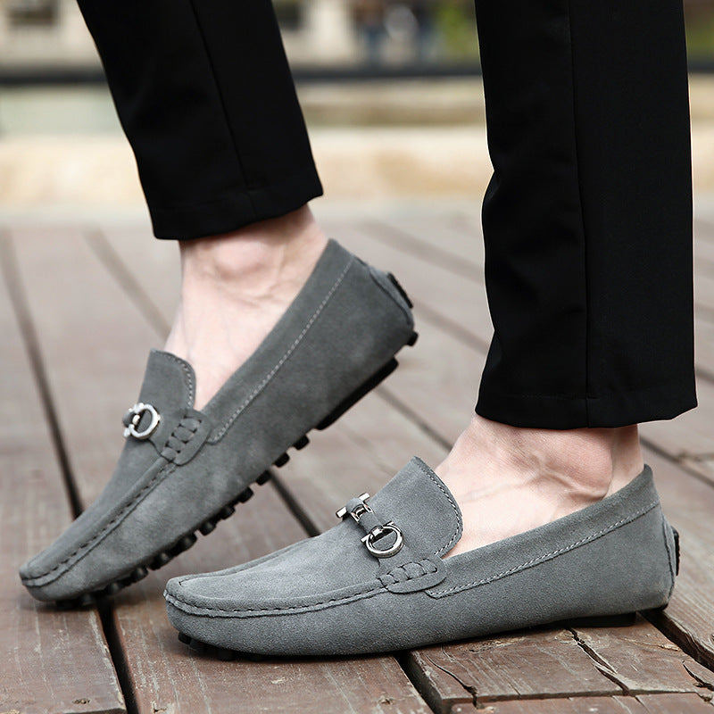 Close-up of black men's slip-on moccasin loafers, showcasing texture and comfortable everyday style.