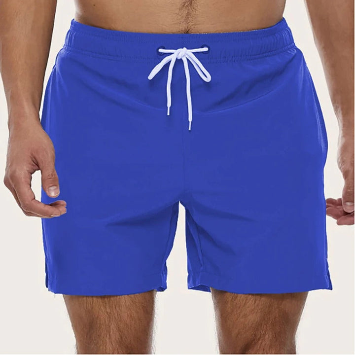 Comfortable men's swim shorts with elastic waist & quick-dry fabric, ideal for pool, beach, and active summer days.