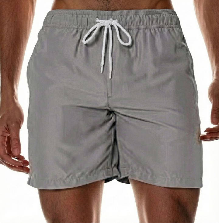 Men's quick-dry swim shorts offer comfort and style for summer beachwear, pool, and active outdoor vacations.