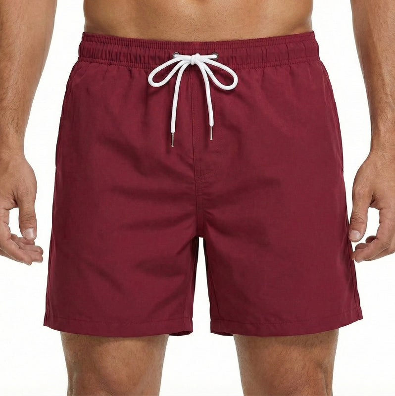 Men's quick-dry board shorts, elastic waist for comfort. Essential beachwear for summer, pool, and resort trips.