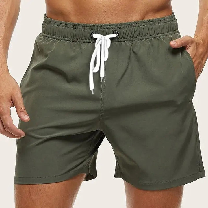 Durable men's quick-dry athletic swim shorts with elastic waist, designed for ultimate comfort and summer fun.