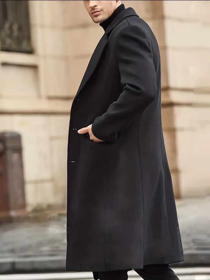 Elegant men's slim fit long trench coat. Features notched lapel for a sharp, classic fall & winter outerwear look.