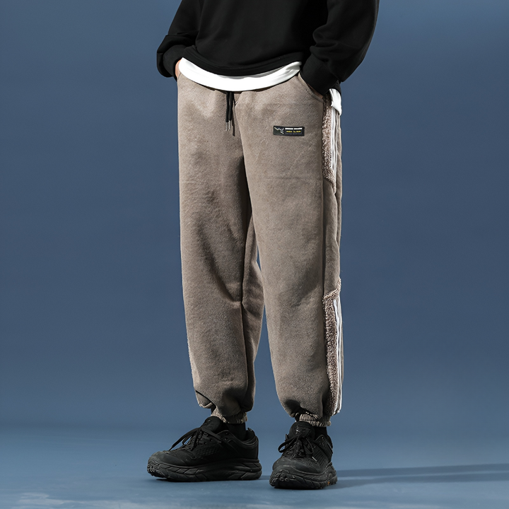 Modern men's street style jogger pants with a comfortable baggy fit, suitable for athletic and lounge wear.