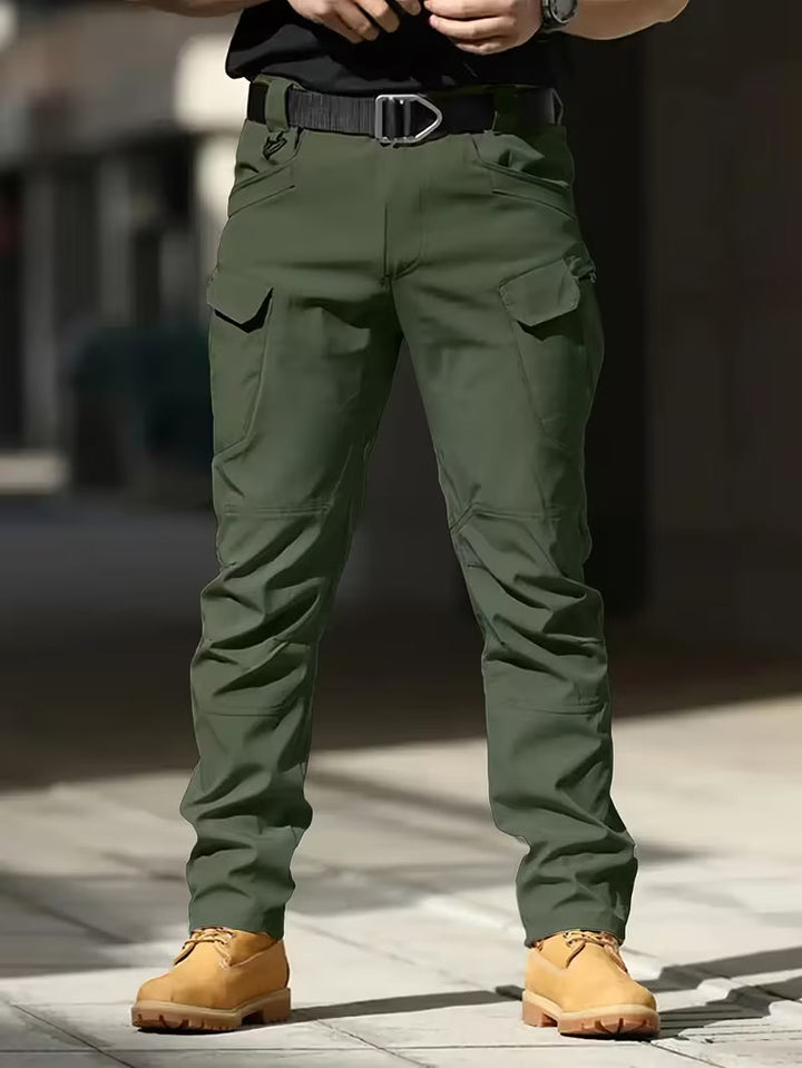 Robust men's work pants, cargo style with multiple pockets, built for heavy-duty tasks.