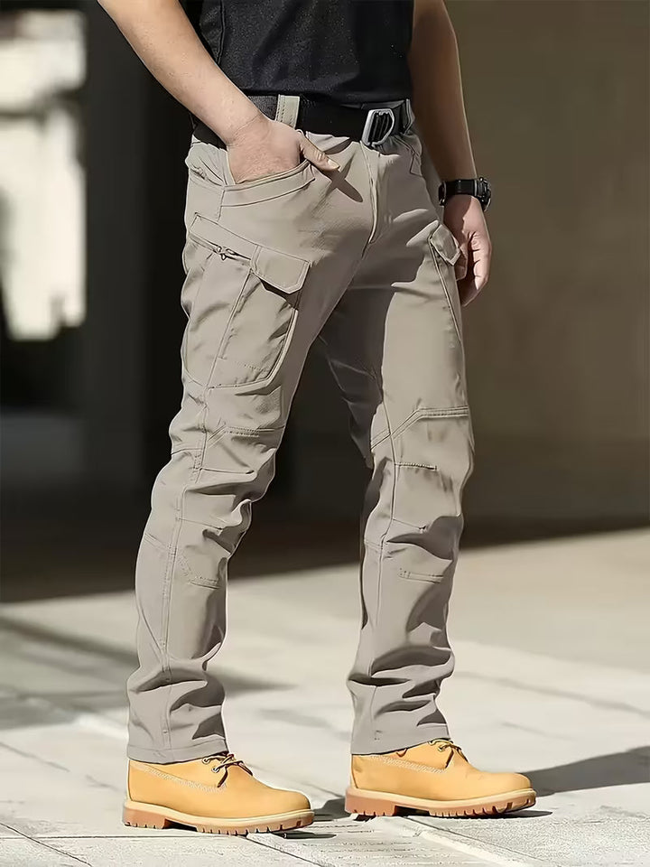 Durable men's cargo pants for work, multi-pocket design keeps essentials secure.