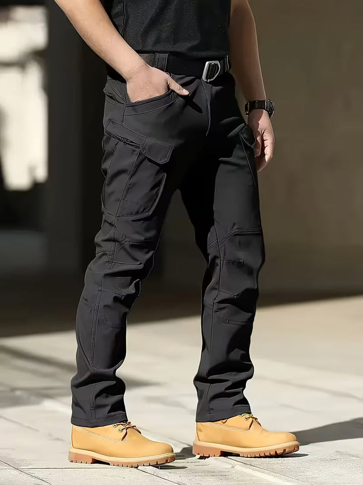Men's durable cargo work pants with multiple utility pockets for heavy-duty tasks.