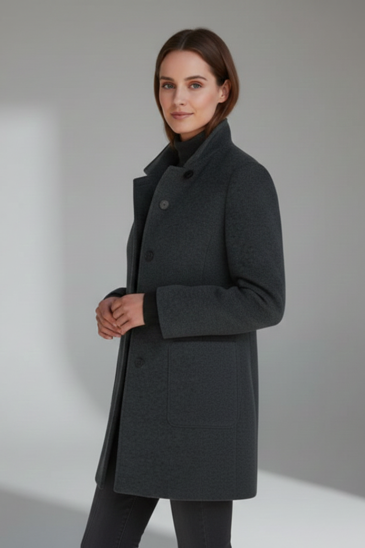 Women's mid-length coat featuring a stand collar and button closure. An elegant long-sleeve outerwear piece.