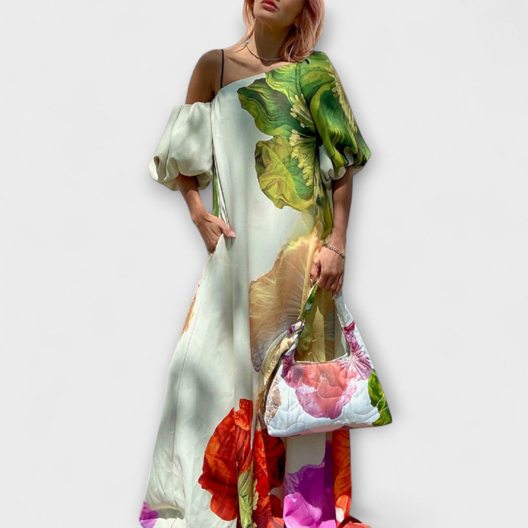Elegant women's off-shoulder floral maxi dress, perfect for summer vacations, resort wear, or a chic party. Flowing style.