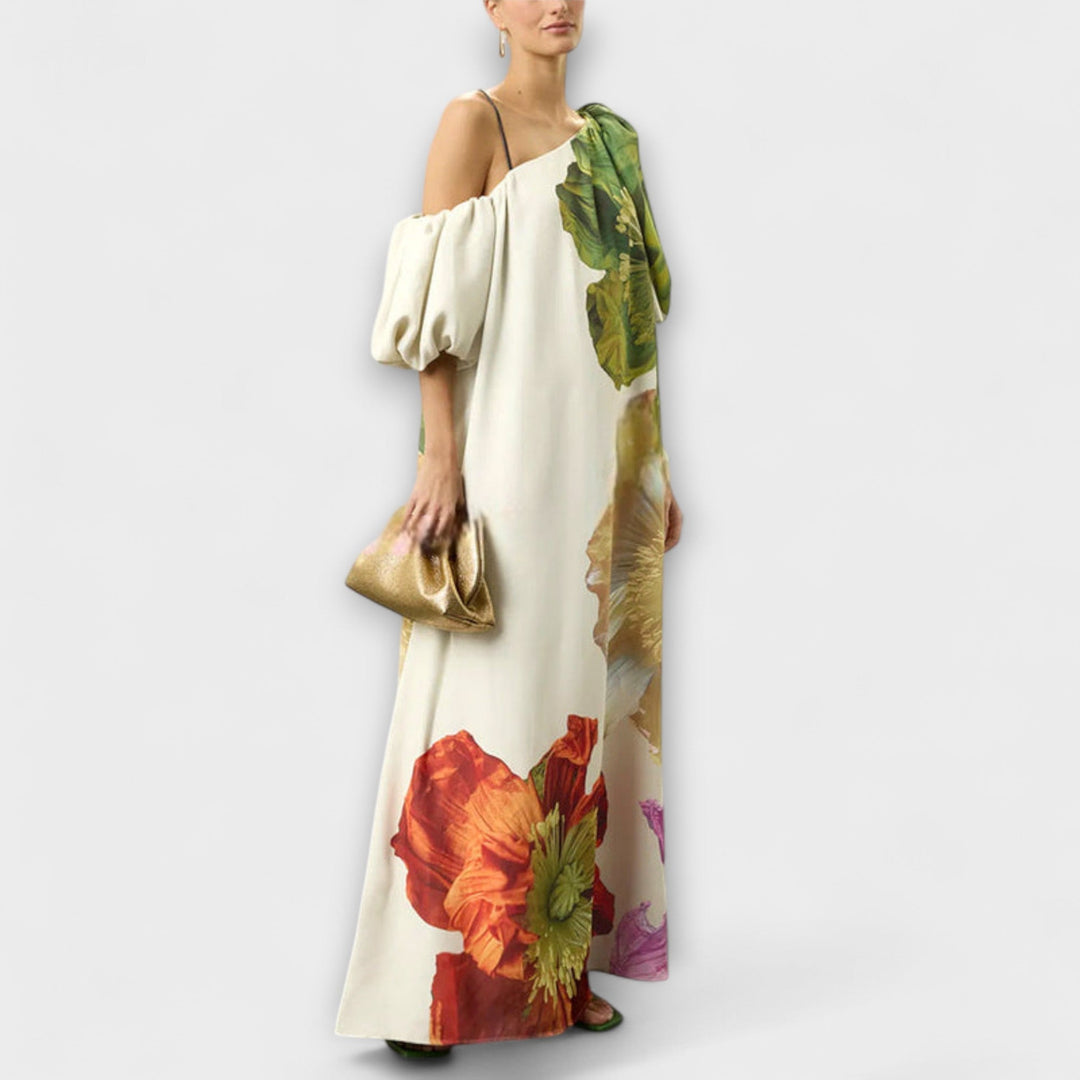 Comfortable flowing women's off-shoulder maxi dress with vibrant floral print. Perfect for elegant summer vacation wear.