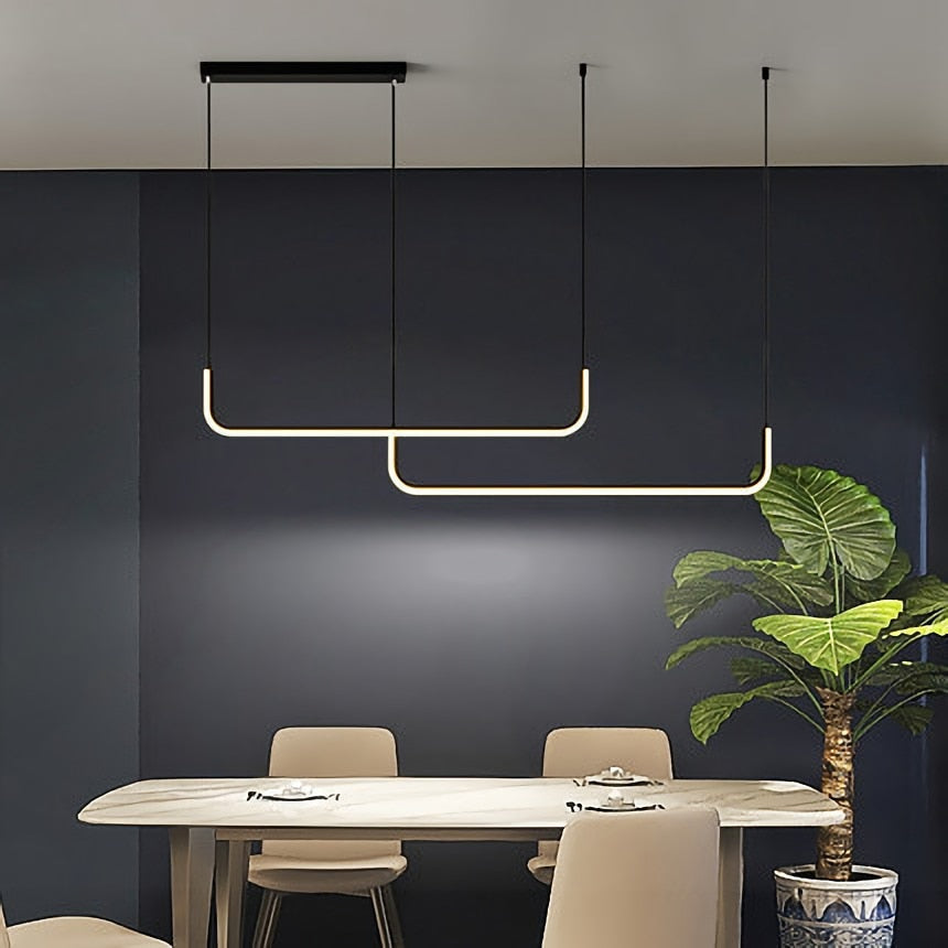 Modern Arisha pendant light with LED, gold and black finish for interior lighting.