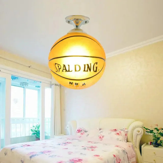 Vibrant kids' sports LED ceiling light. Football & basketball decor brightens playrooms and children's bedrooms.