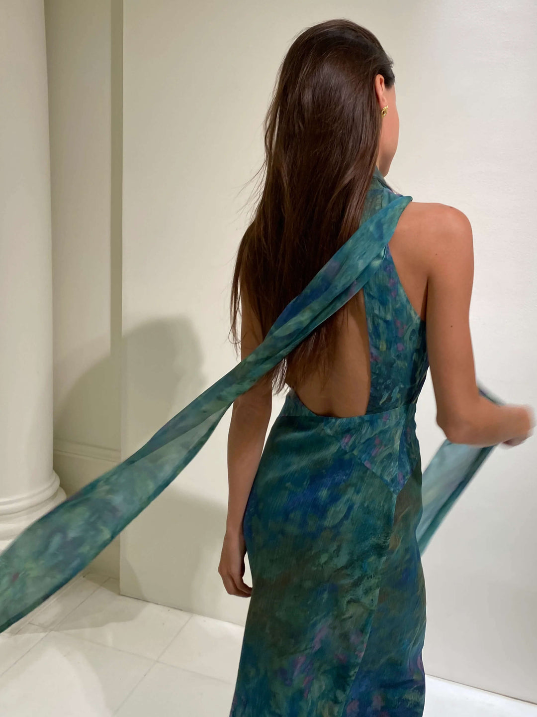 Chic Women's Art-Inspired High-Neck Maxi Dress. Elegant long evening gown with an alluring open back design.