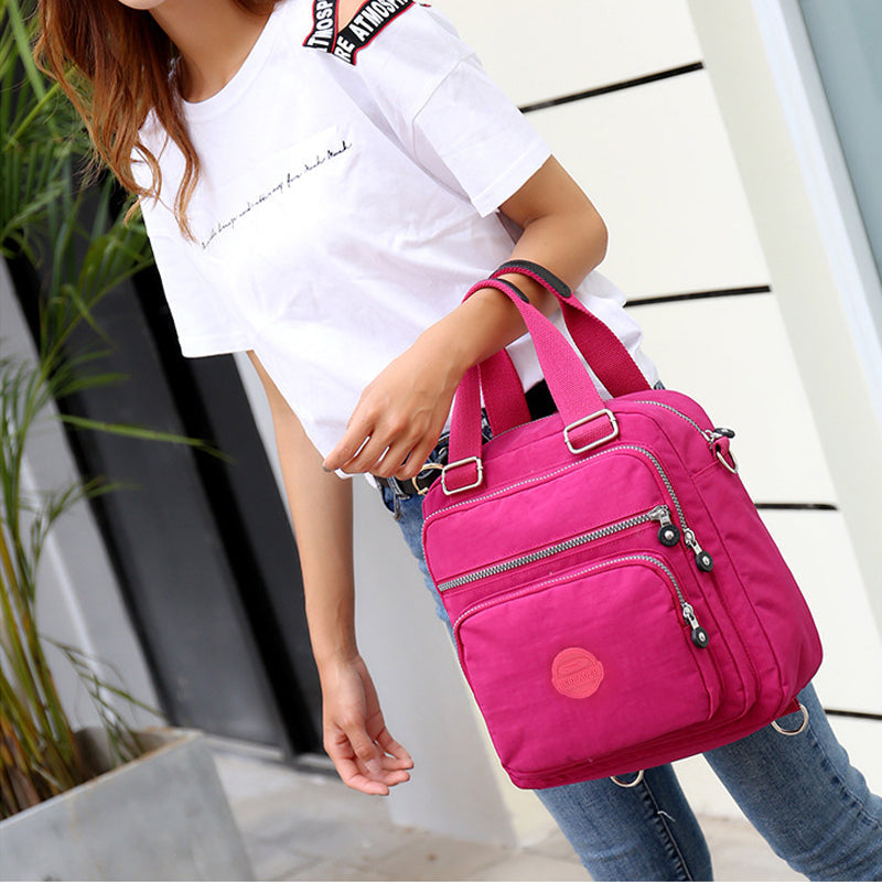 Stylish new women's water-resistant messenger bag, perfect for urban adventures. Versatile multi-compartment design.