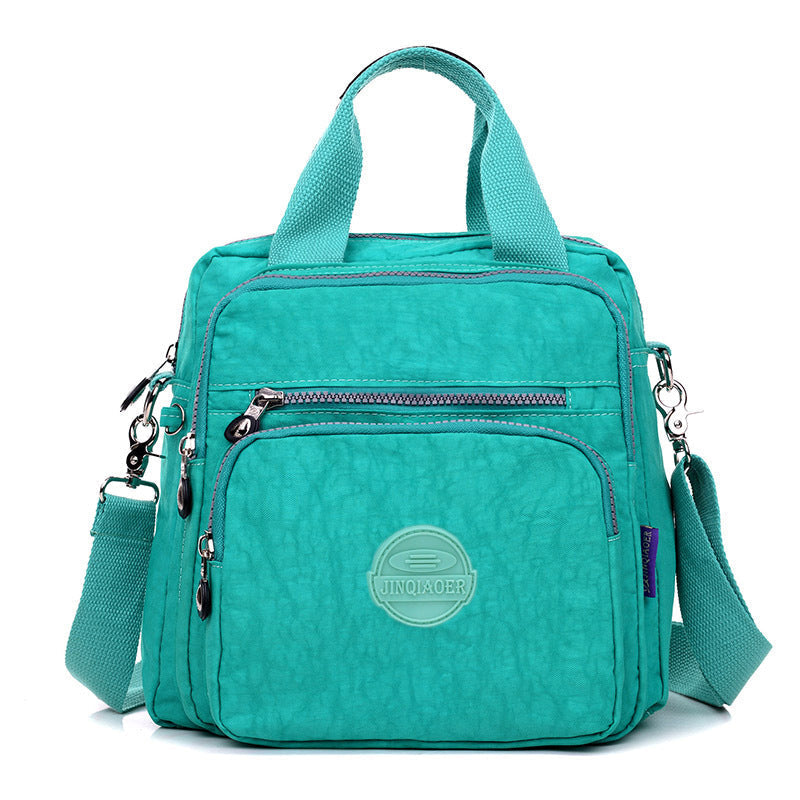 Versatile new women's messenger bag, water-resistant and suitable for travel & daily use. Multifunctional design.