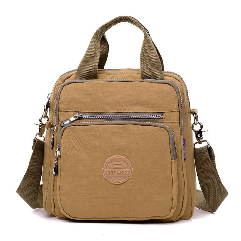 Back view of new water-resistant women's shoulder bag, showing comfortable and adjustable strap.