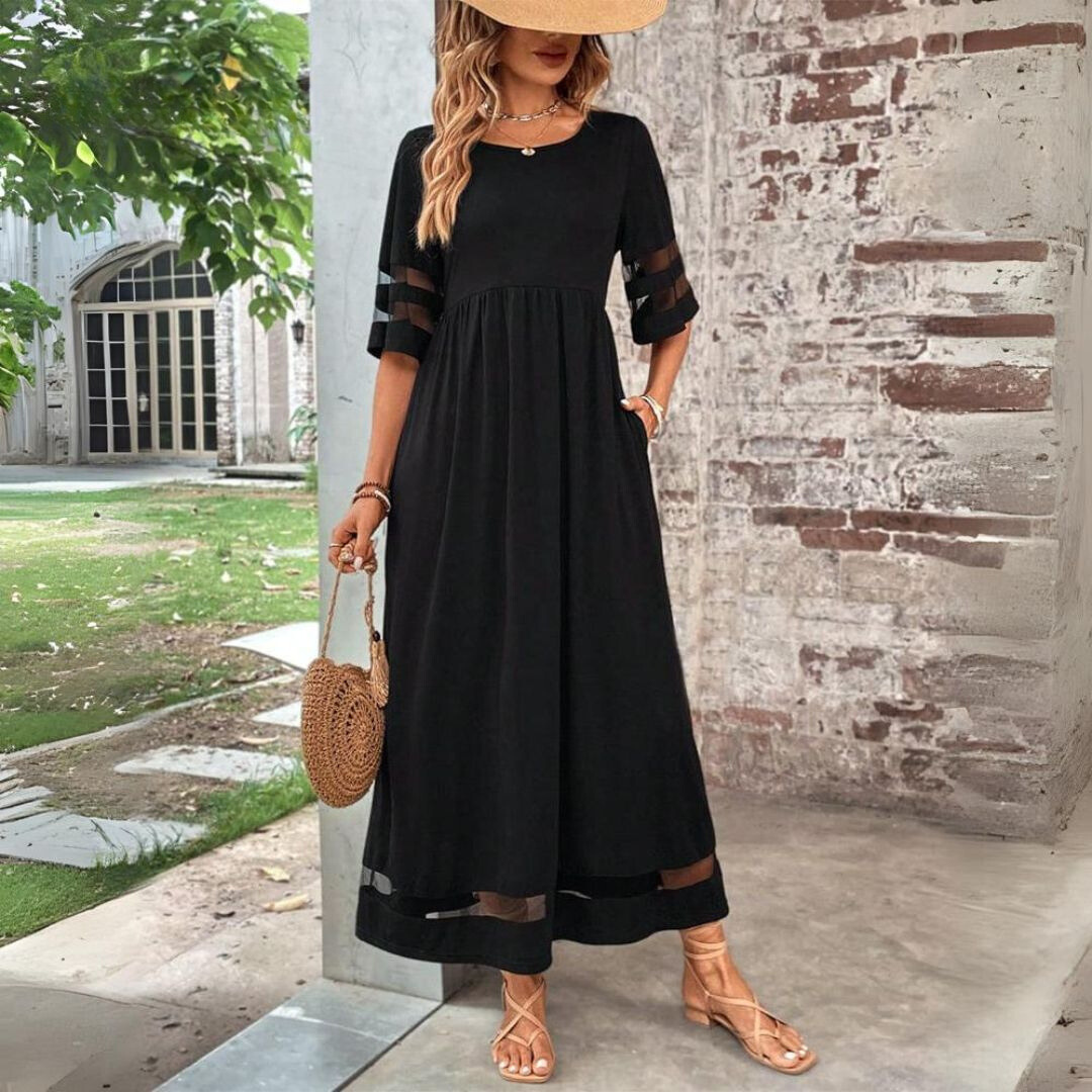 Flattering empire waist long sleeve midi dress for women, with a comfortable flowy skirt for casual or semi-formal looks.
