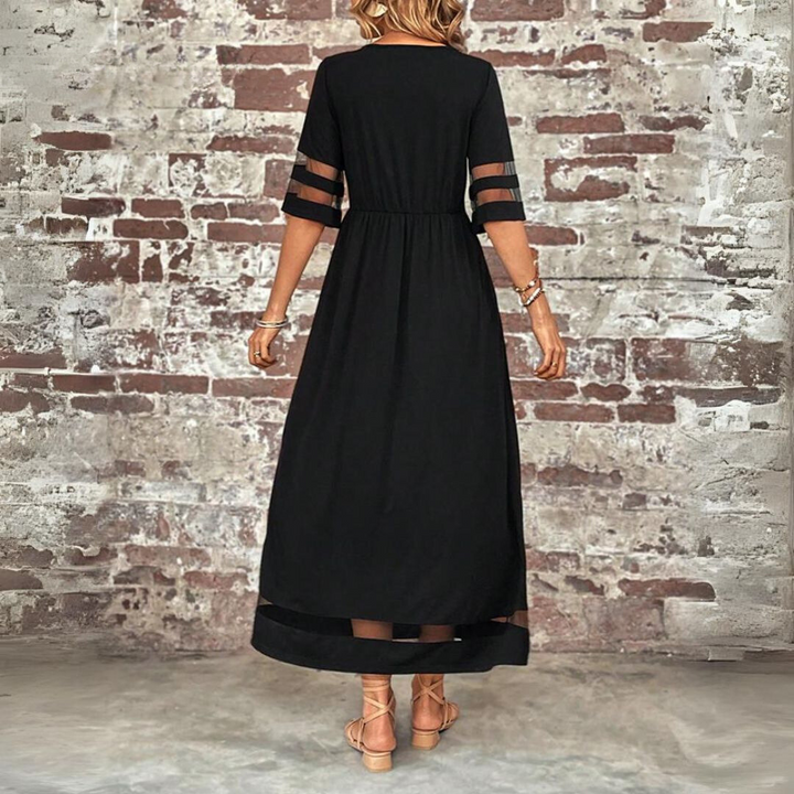 Women's elegant long sleeve midi dress, showing a round neckline and soft fabric; a comfortable and flattering style.