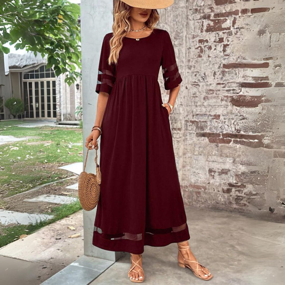 Stylish women's long sleeve midi dress in motion, highlighting its flowy skirt and comfortable, elegant design.
