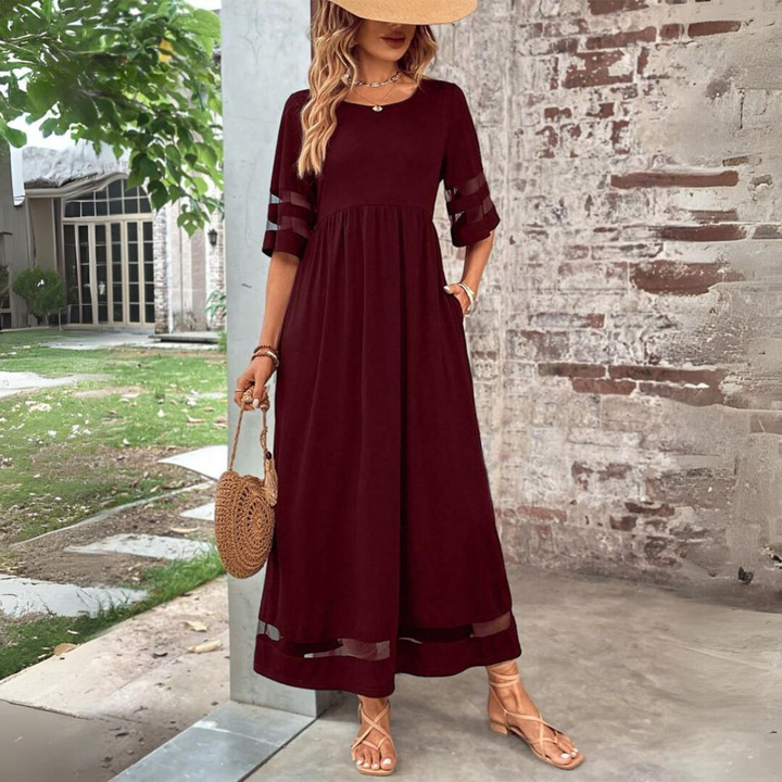 Stylish women's long sleeve midi dress in motion, highlighting its flowy skirt and comfortable, elegant design.