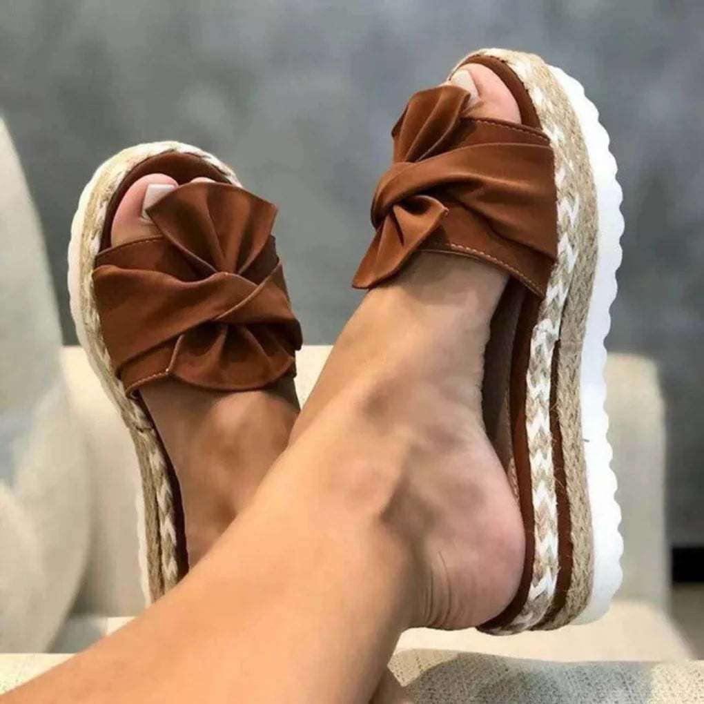 Women's comfortable flat bow sandals, perfect slip-on casual footwear for spring and summer vacation.