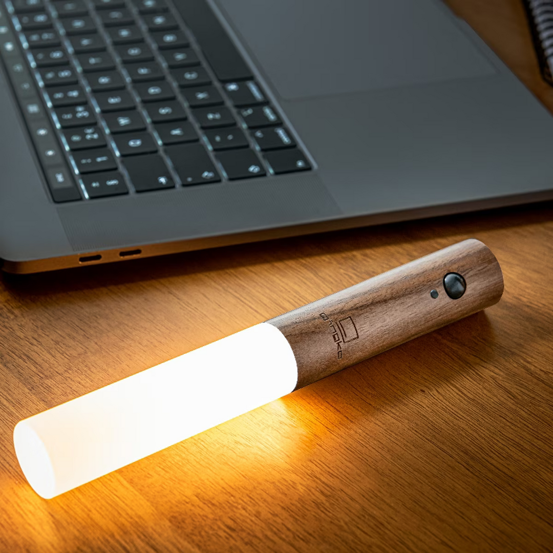 Stylish magnetic LED wall light, rechargeable with motion sensor for convenient night lighting.