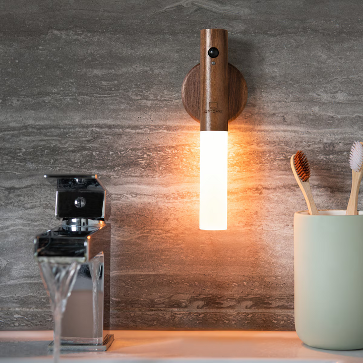 Cordless modern wall light, magnetic mount, motion sensor, and rechargeable for easy placement.
