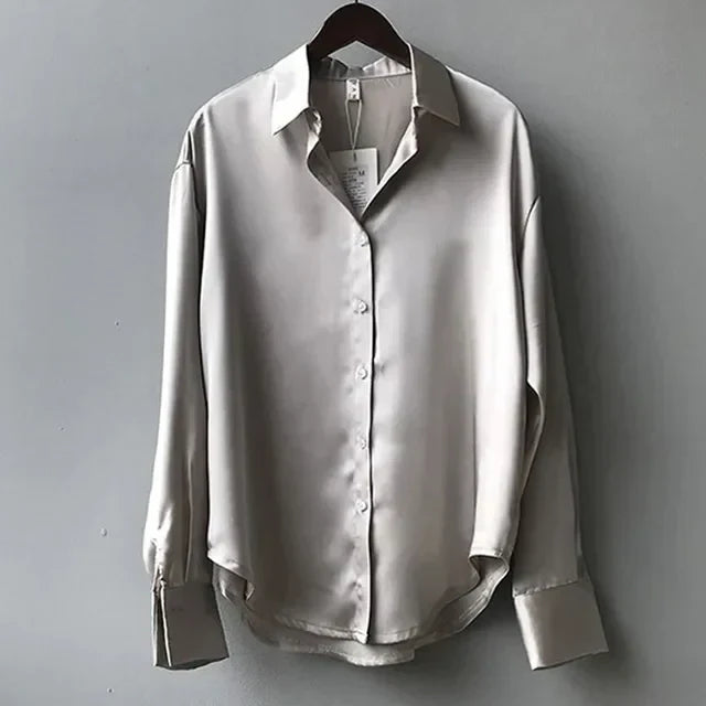 Comfortable women's long sleeve button-up blouse with V-neck, loose fit, ideal for everyday elegant style.