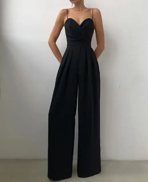 Chic women's wide-leg jumpsuit with delicate spaghetti straps. Ideal for elegant evening events or stylish summer outfits.