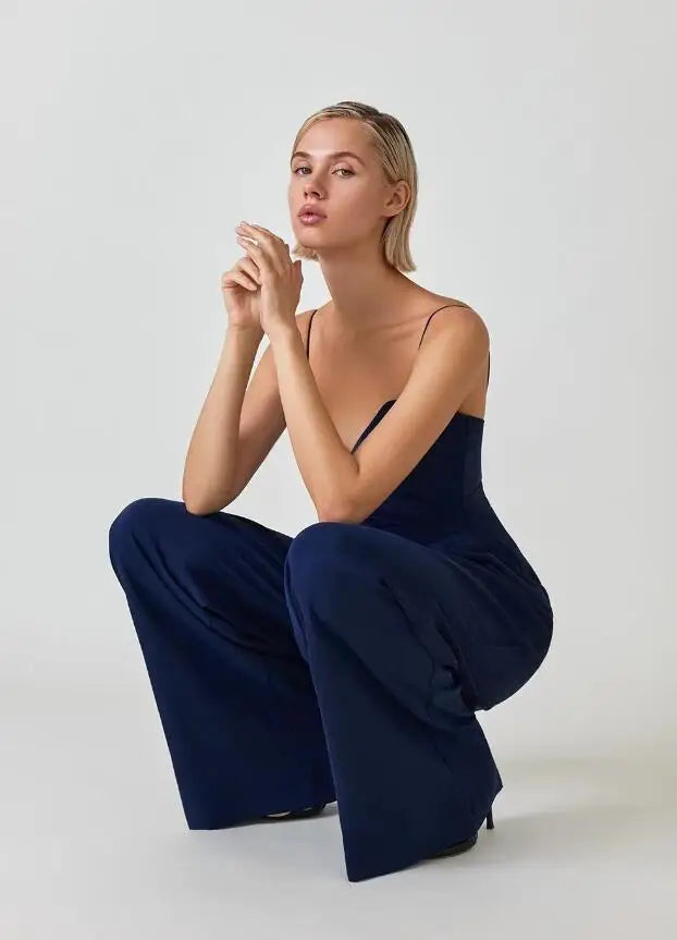 Lightweight wide-leg jumpsuit for women, spaghetti strap design. Essential for elegant summer fashion & comfort.