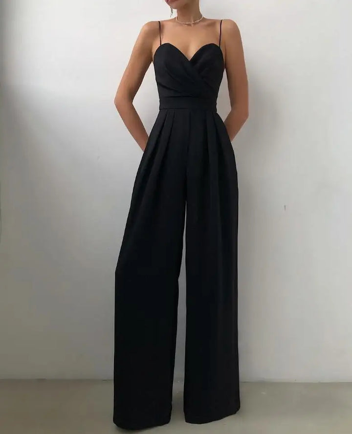 Sophisticated wide-leg women's jumpsuit with spaghetti straps. Ideal elegant evening wear for a chic, confident look.