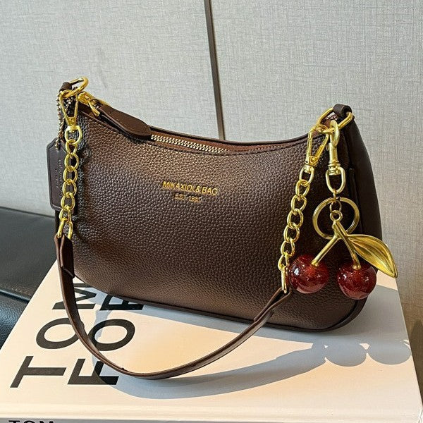 Women's structured black faux leather crossbody bag, versatile and fashionable.