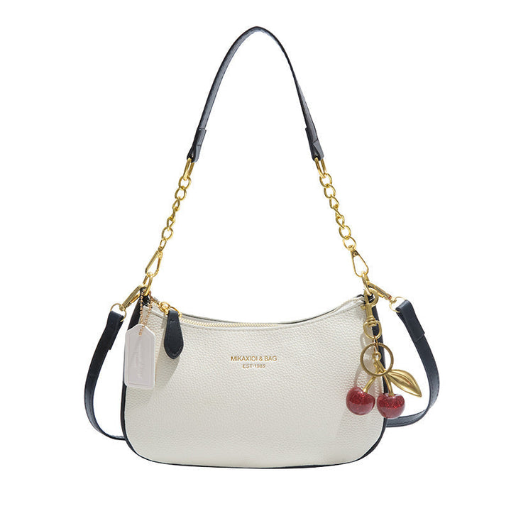 Brown faux leather structured shoulder bag, elegant and chic accessory for women.