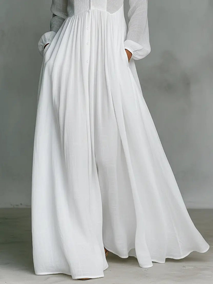 Model wearing a flowing women's collared relaxed fit maxi dress, suitable for comfortable everyday fashion.