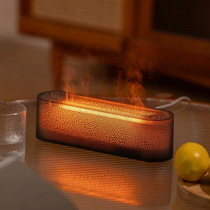 Modern flame effect humidifier for essential oil diffusion. Enhances home ambiance with LED mist.