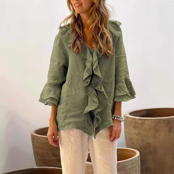 Stylish women's ruffled 3/4 sleeve top, offering an elegant yet relaxed fit for modern ladies wear.