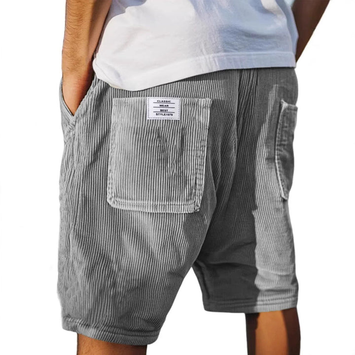 Men's textured tailored shorts in a neutral tone, perfect for a polished summer look and everyday style.