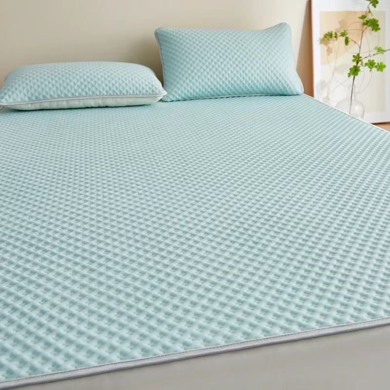 Close-up of a cooling mattress topper with non-slip base, providing pressure relief and temperature regulation.