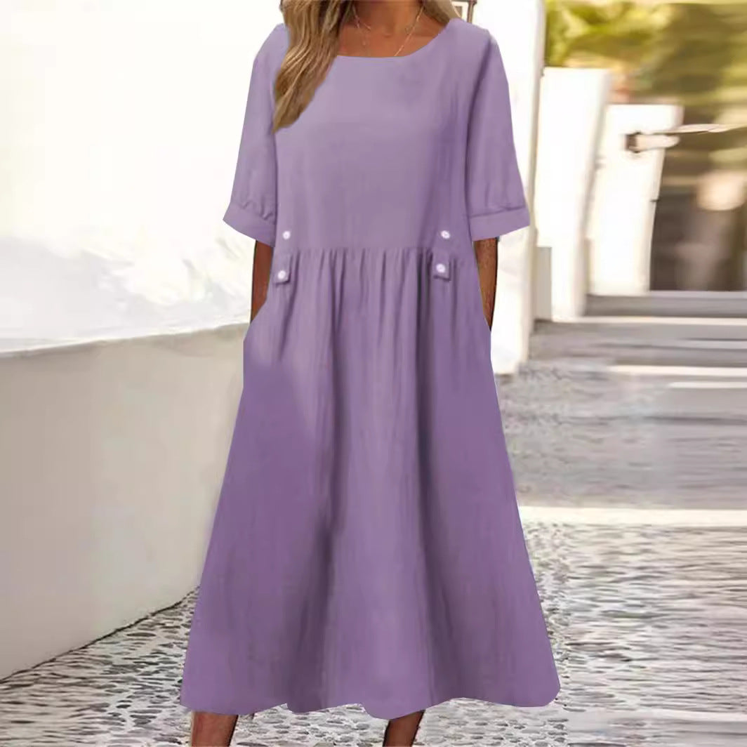 Elegant women's breezy summer midi dress with round neck, short sleeve, ideal for casual everyday wear.