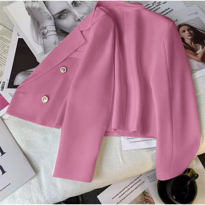 Chic women's cropped double-breasted blazer. Tailored lapel jacket, ideal for versatile fashion layering.
