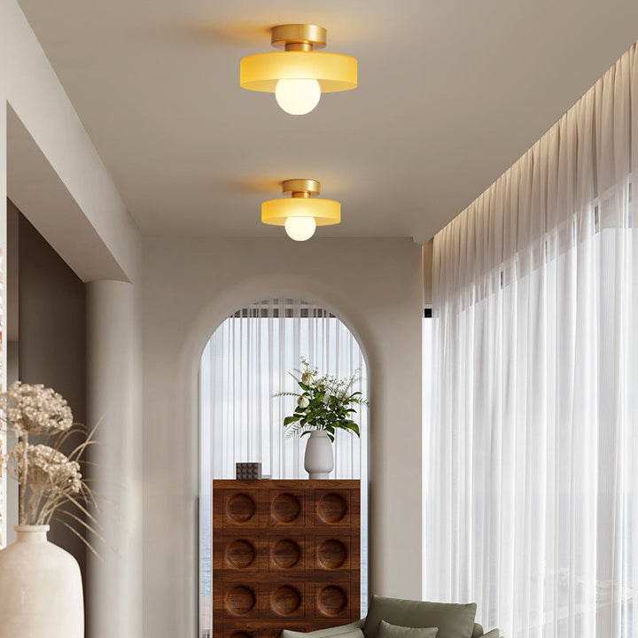 Contemporary Bauhaus lighting fixture, brass details, sophisticated ceiling decor.