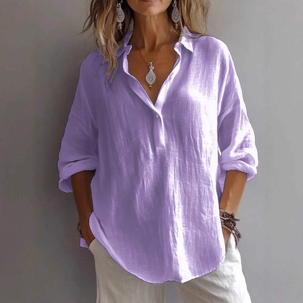 Stylish women's button-up blouse with flowing wide sleeves, ideal for a relaxed look.