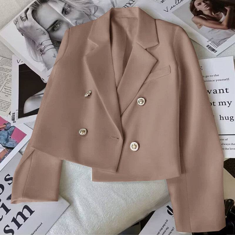 Pink women's cropped double-breasted blazer. Tailored lapel jacket, perfect for versatile layering.