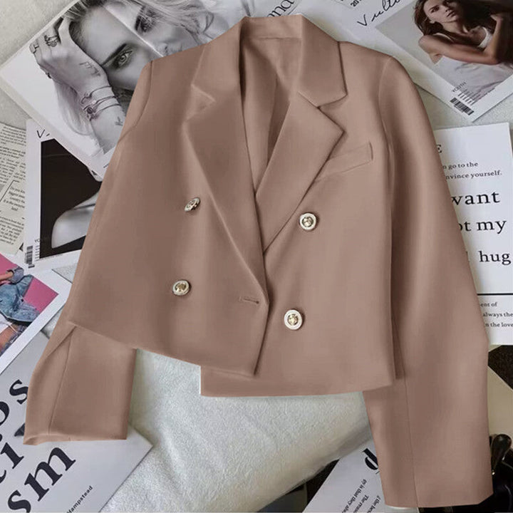 Pink women's cropped double-breasted blazer. Tailored lapel jacket, perfect for versatile layering.