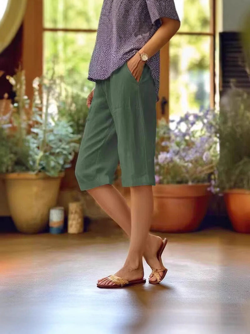 Chic tailored women's straight leg shorts, knee-length design ideal for versatile summer outfits.