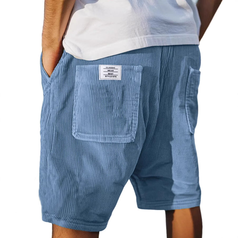 Close-up of men's high-quality textured tailored shorts, ideal for versatile smart or casual everyday summer outfits.