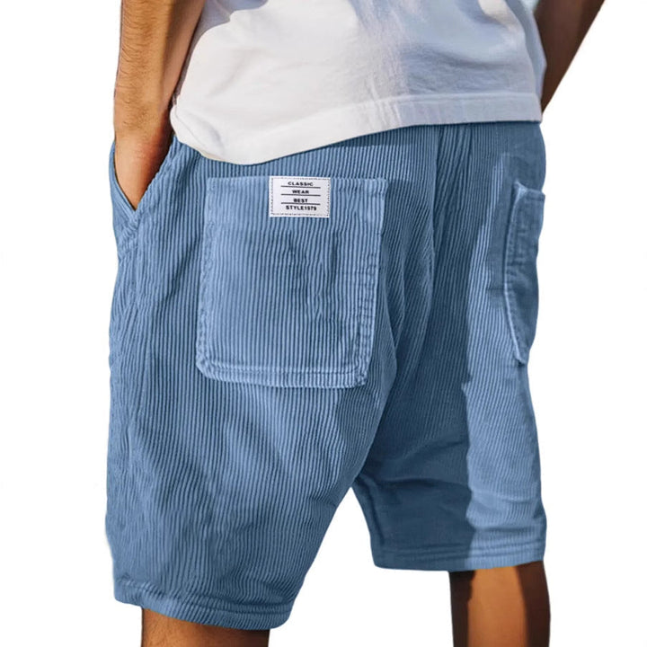 Close-up of men's high-quality textured tailored shorts, ideal for versatile smart or casual everyday summer outfits.