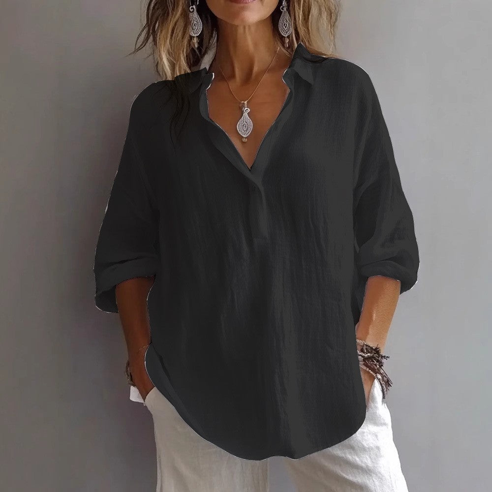 Relaxed fit women's button-up blouse with wide sleeves, comfortable everyday wear.